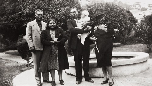 Sisters Margaret (left) and Bertha Tumamait with their husbands, Raymond John Durante and Joe Blanco holding Jerome Duarte at his baptism at Old San Buenaventura Mission : October 14, 1945