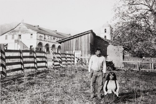 A Barbareño Chumash couple, possibly Justo and Cecilia, at the site of the old Indian adobe house at Mission Santa Barbara