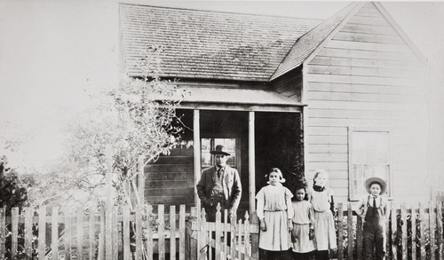 Albert Leiva and the Barrios children in front of their parents' home at 104 East Meta Street, Ventura : circa 1905