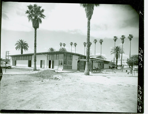 View of the community building and swings at Salazar Park