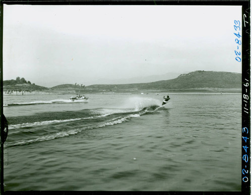 View of water skiers on Puddingstone Lake at Frank G. Bonelli Regional Park