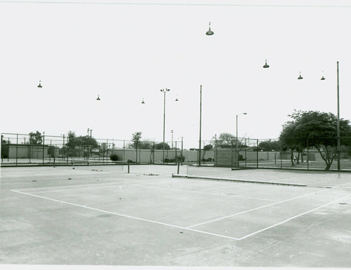 View of installation of tennis court lighting at Roosevelt Park