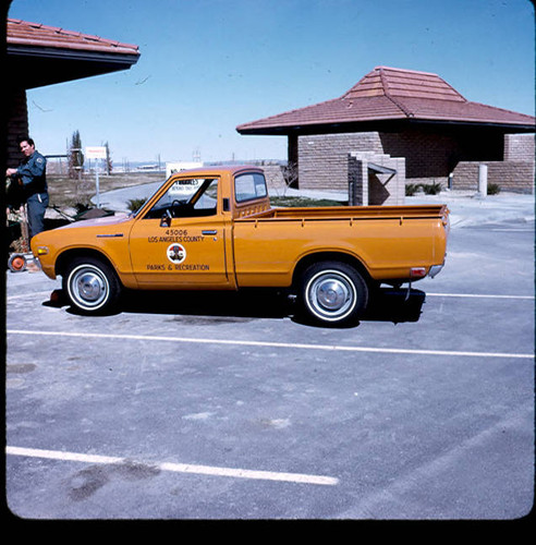 View of County of Los Angeles Department of Parks and Recreation vehicle and employee at Apollo Park