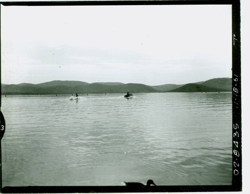 View of water skiers on Puddingstone Lake at Frank G. Bonelli Regional Park