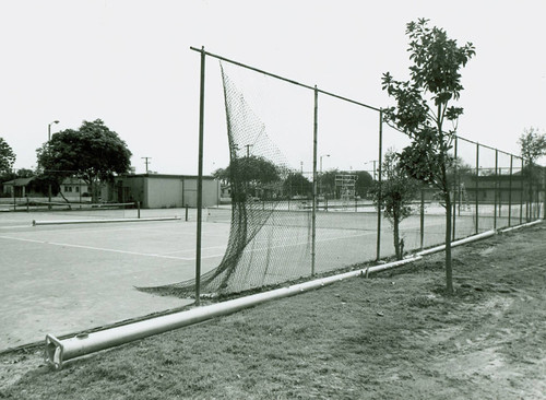 View of installation of tennis court lighting at Roosevelt Park