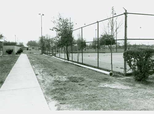 View of installation of tennis court lighting at Roosevelt Park