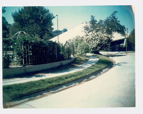 View of fencing surround the playground and the sports dome at City Terrace Park