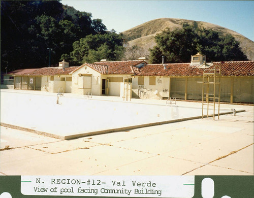 View of the pool and community building at Val Verde Park