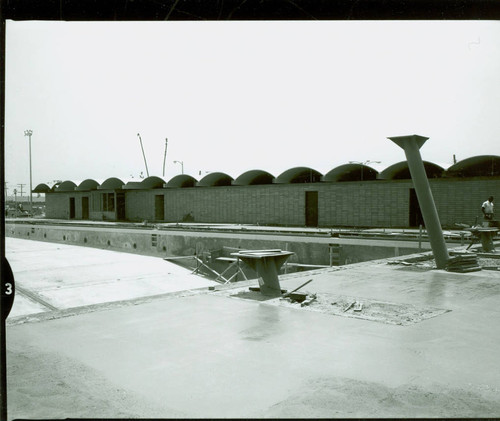 View of construction of the pool and pool house at Victoria Park