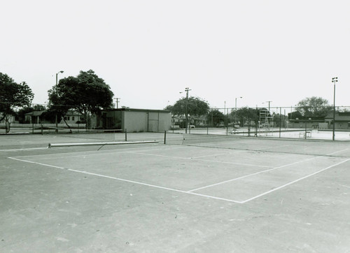 View of installation of tennis court lighting at Roosevelt Park