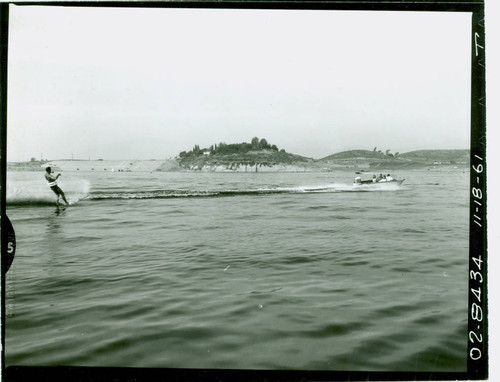 View of water skiers on Puddingstone Lake at Frank G. Bonelli Regional Park