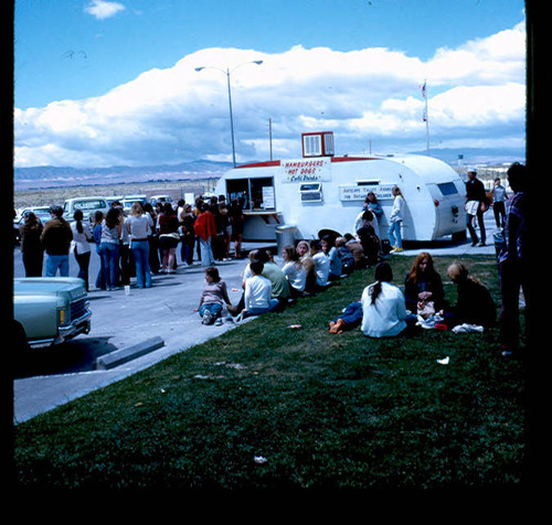 View of visitors and food stand at Apollo Park