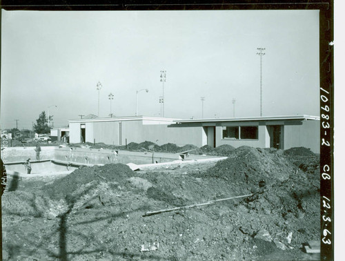 View of construction of the swimming pool and pool house at Enterprise Park