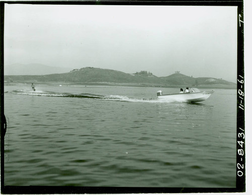 View of water skiers on Puddingstone Lake at Frank G. Bonelli Regional Park