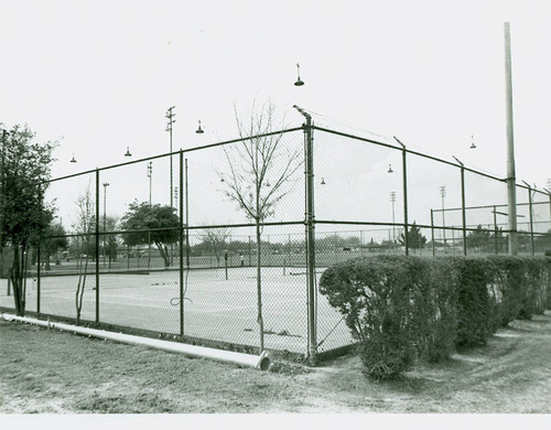 View of installation of tennis court lighting at Roosevelt Park