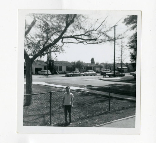 Kenn Young standing in front of childhood house on Coolhurst Dr., Los Nietos, California