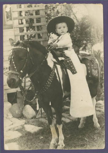 Angel Cabral riding a pony, Whittier, California