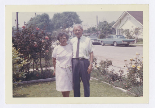 Maria and Ezequiel L. Andrade, Sr. in the front yard, Los Nietos, California