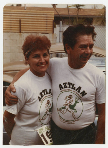 Frances and Robert Holguin in 10K race t-shirts