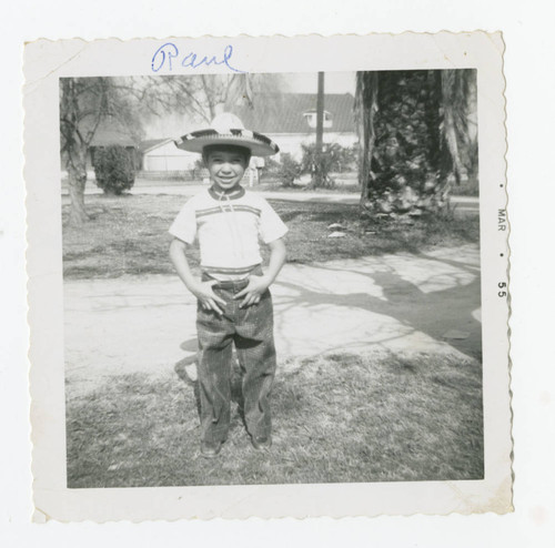 Raul Felix in front of his house, Los Nietos, California