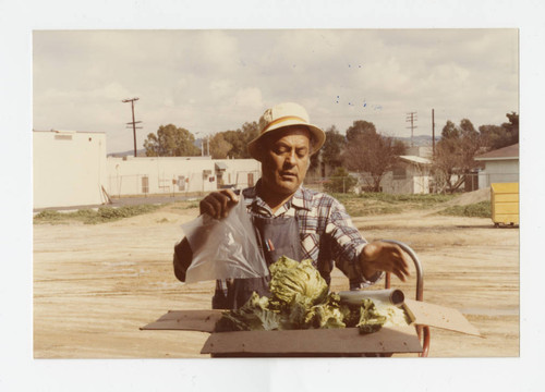 Raul Gallegos at G&G produce stand, Los Nietos, California