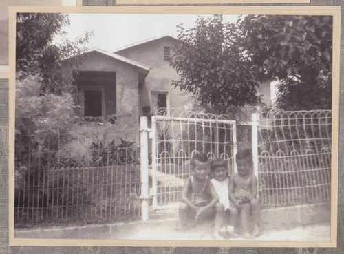 Cabral children sitting in front of their house, Whittier, California