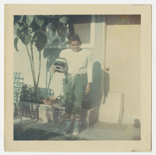 Raleigh Holguin in his football uniform