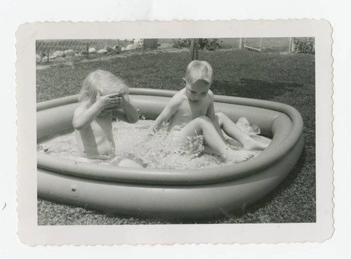 Kids playing in pool, Los Nietos, California