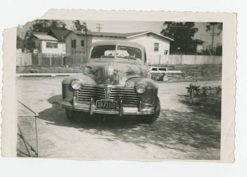 Car entering driveway, Los Nietos, California