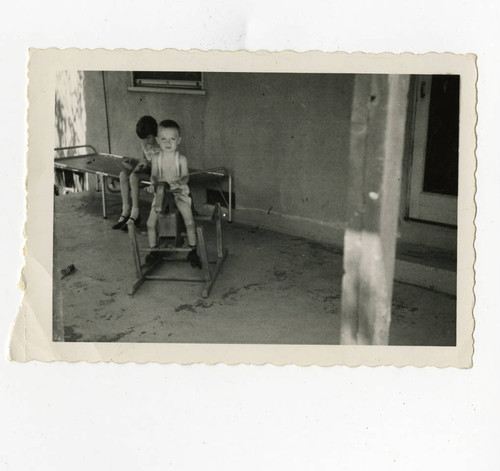 Children playing in the back porch, Los Nietos, California