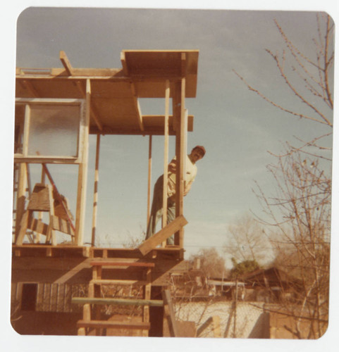 Jose Corona building a tree house in the backyard, Whittier, California