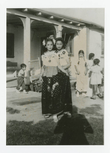 Marquez sisters in folklorico dancing costumes, Santa Fe Springs, California