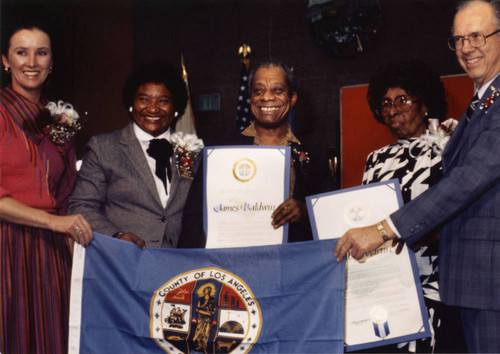 James Baldwin, Sallie Martin, and Others with County of Los Angeles Flag