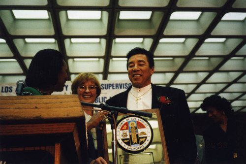 Yvonne Brathwaite Burke Presents Plaque to Smokey Robinson