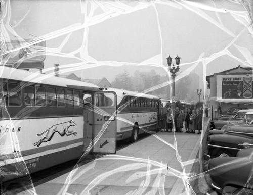 Women and men board a bus