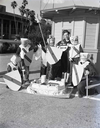 Woman and Boy Scouts publicize Boy Scout Rose Bowl Circus