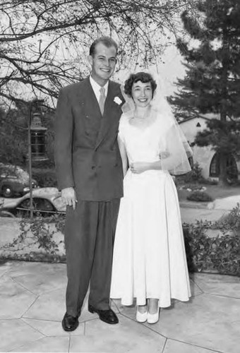 Bride and Groom Standing Outdoors