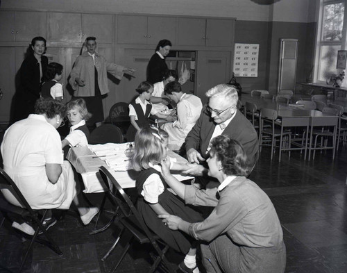 Children receive immunizations