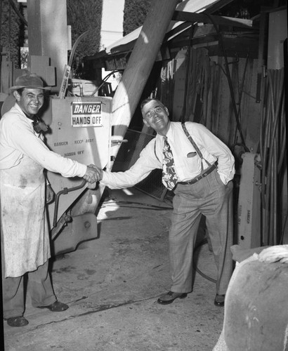 Men in front of machinery