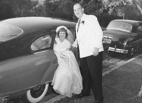 Father Assists Bride Getting Out of the Car