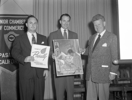 Three men at Red Cross promotion