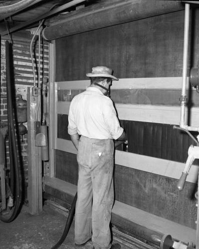 Man in front of machine