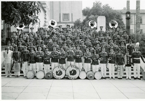 Eliot Huskies marching band posing on the steps of the campus