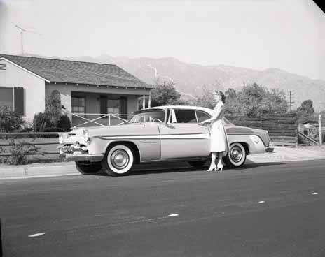 Mrs. America poses with car