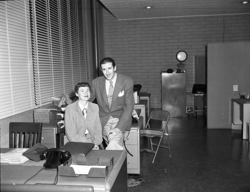 Bill Garr with friend in KWKW offices — Calisphere