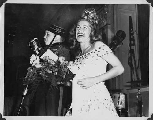 Sunnie Merrill from UCLA is crowned "Miss College Advertising" by Philip Morris spokesman "Johnny" for Woodbury College's Huckster's Ball