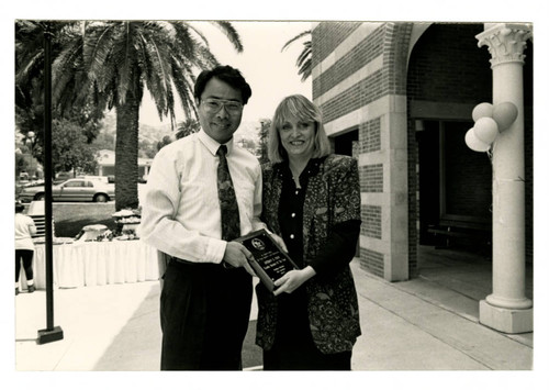 Anthony Chan Holding an Award at the 1993 Woodbury University Awards Convocation