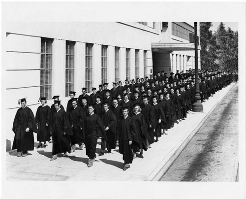 A Procession of Woodbury College Graduates in Front of the Campus Building on Wilshire Boulevard