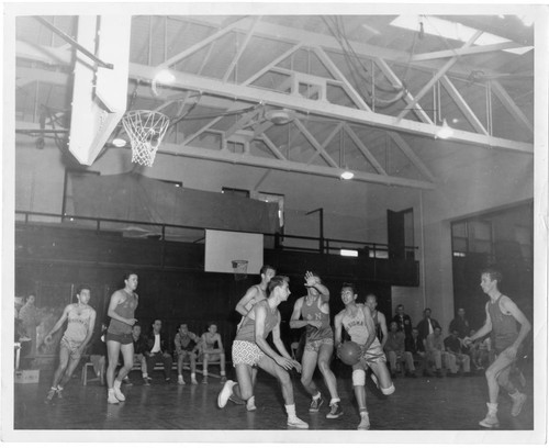 Two Fraternities Compete in a Woodbury College Intramural Basketball game