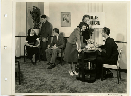 Students Converse in "Date Bureau" Office